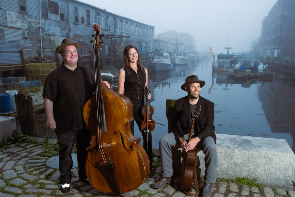 Darlin-Corey-Strung Together Music Camp Darlin' Corey features the singing and playing of Erica Brown, Matt Shipman and Kris Day. Their music is a diverse and unique blend of folk with influences from bluegrass and old time music.