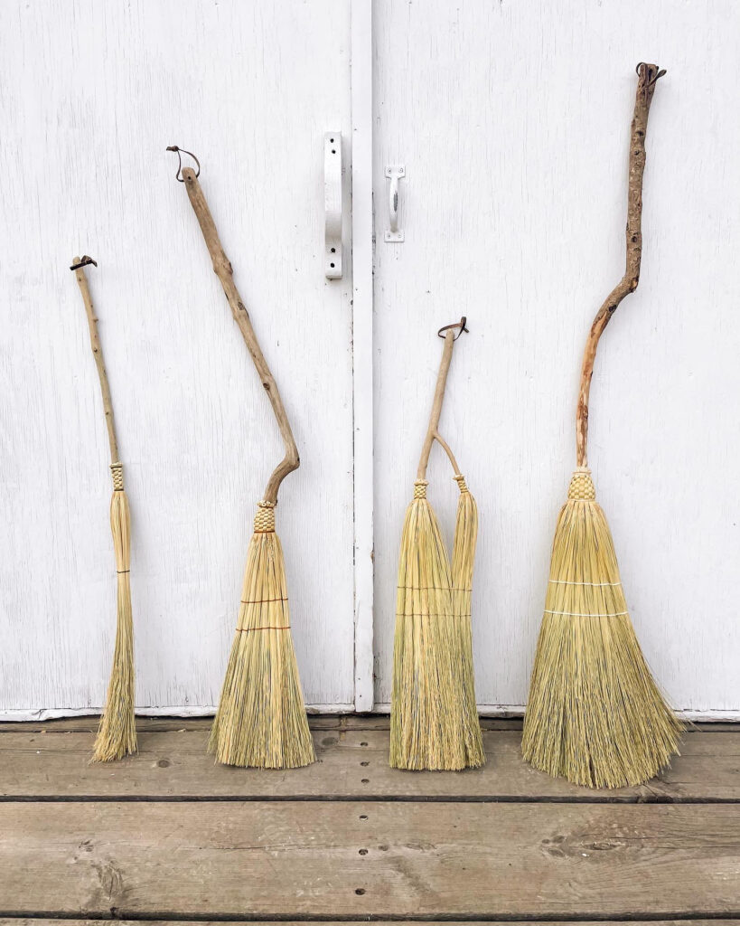 Brooms made by artist Lin Elkins. Making classes offered this summer.